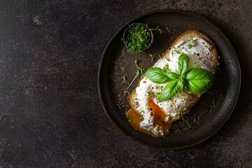 bruschetta with cottage cheese, poached egg and basil