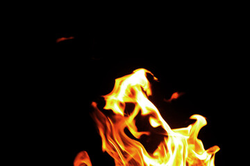Close up burning flames on black background for graphic design or wallpaper.