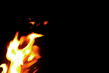 Close up burning flames on black background for graphic design or wallpaper.