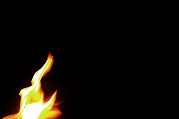 Close up burning flames on black background for graphic design or wallpaper.