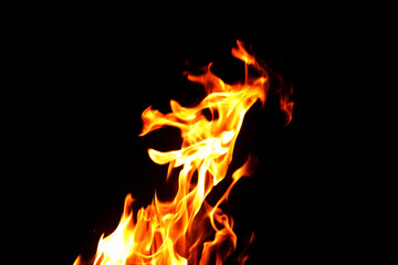 Obraz premium Close up burning flames on black background for graphic design or wallpaper.