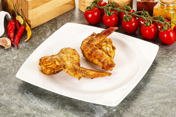 Tasty roasted chicken wing with spices