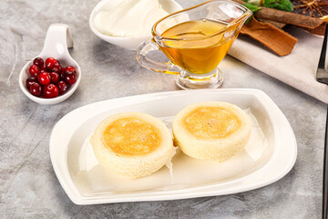 Fototapeta premium Roasted cheesecakes - Syrniki with honey