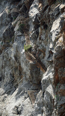Steps  in side of cliff  in nvertical format