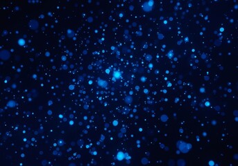 Fototapeta premium Numerous small blue bokeh circles scattered against a dark background