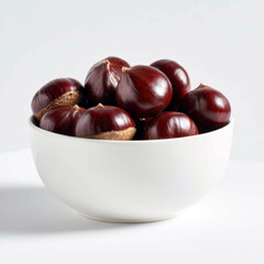 Obraz premium Sweet Chestnuts in White Bowl on Plain Background for Food Photography