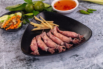 Boiled wild mini calamari snack