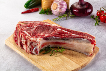 Raw prime beef steak with bone
