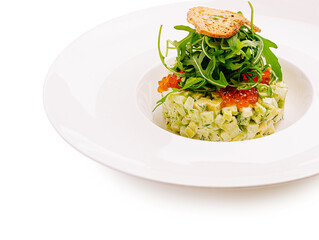 Fresh avocado tartare with herbs and greens served elegantly on a plate
