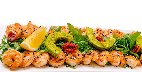 Seafood platter with shrimp and greens at a coastal eatery