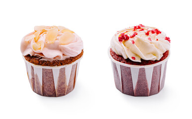 Delicious cupcakes with frosting and toppings on a white background