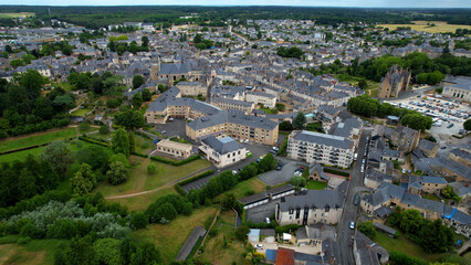 Aerial view around the old town of the city Baugé-en-Anjou in France on a sunny summer morning