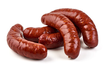 Stacked smoked sausages, isolated on white background