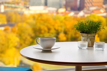 Morning coffee on the table, golden autumn outside the window.