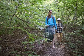 Mother and children hiking in the forest