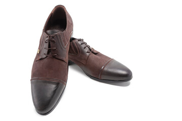 Footwear Concepts. One Pair of Stylish Classic Formal Male Combined Materials  Black and Brown Calf Leather Derby Laced Shoes Placed Together Over White.
