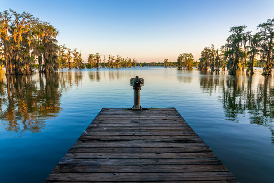 Fishing pier at Lake Martin, Cypress Island Preserve, Cypress swamp scenic landscape with reflections, Breaux Bridge near Lafayette, Louisiana