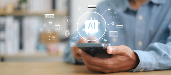 Chat with AI or Artificial Intelligence. Young businessman chatting with a smart AI or artificial intelligence using an artificial intelligence chatbot developed by OpenAI.