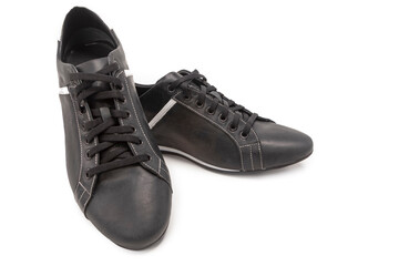 One Pair of Stylish Classic Sportive Male Stylish Black Calf Leather Laced Shoes Placed Together On One Another Over White.