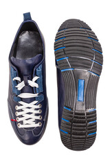 Mens Footwear Concepts. One Pair of Stylish Sportive Formal Male Dark Blue Leather Sneakers Shoes Placed Together Over White.