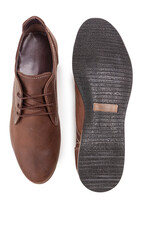 Footwear Concepts. One Pair of Stylish Classic Formal Male Dark Brown Leather Chukka Boots Shoes Placed Together Over White.