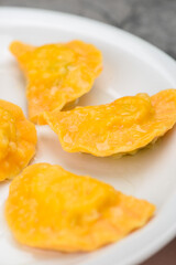 fried dumplings in a white plate vertical photo