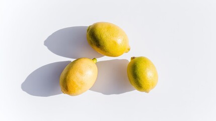 Three lemons with shadows on white background