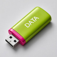 Green and pink USB drive labeled 'DATA' on a gray background.