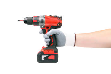 A hand grips a cordless drill equipped with a battery isolated on white background.