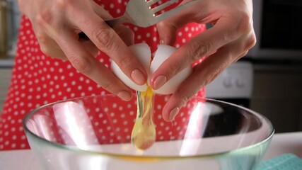 Pastry chef woman hands cooking cracking eggs into glass bowl on kitchen., preparing ingredients for baking cake at home. Culinary skills, cuisine, homemade prepare dish meal. Domestic food recipe.