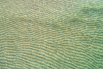 A stunning and peaceful image of the shallow waters of a beautiful beach summer vacation concept