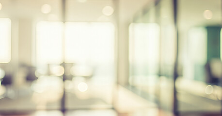 Blurred office interior with glass walls and light bokeh effect, creating a modern, bright, and airy workspace with organized layout, clean lines, and professional atmosphere.