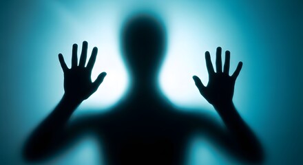 Silhouette of a person pressing hands against a frosted glass surface, creating a mysterious effect.