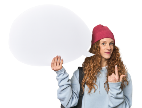 Redhead holding a comic speech bubble pointing with finger at you as if inviting come closer.