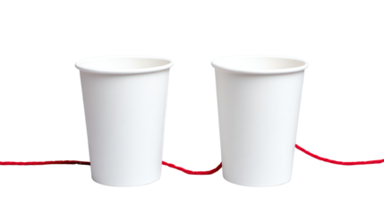 Two white paper cups connected with a red string, symbolizing communication and connection.