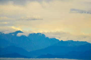 landscape with mountains and clouds in sunset