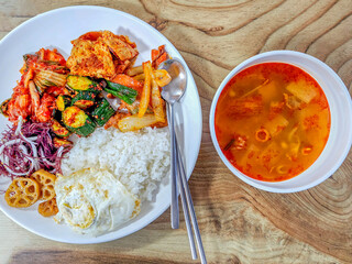 Traditional Korean Meal with Rice, Side Dishes, and Spicy Soup