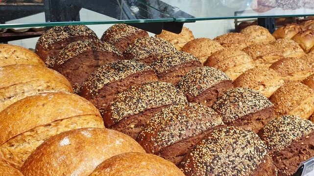 Footage of the various bread products in the bakery shop. Food