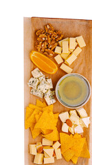 Assorted cheese platter with chips, nuts, and fruit for a gathering