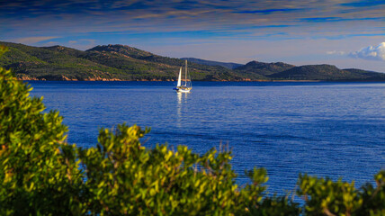 Sailboat landscape along the Corsican coast in France
