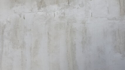 Old grey concrete wall with stains, uneven color, building wall, house, shop, building wall texture image.