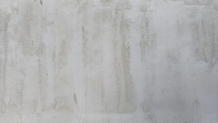 Old grey concrete wall with stains, uneven color, building wall, house, shop, building wall texture image.
