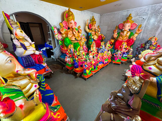 Newly made idols of the God known as Ganesha or Ganapati for sale at a shop on the eve of Ganesh festival in south India.