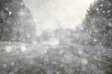 snowfall on a winter road, abstract background, blurred highway backdrop snowy landscape