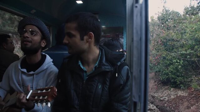 A man enjoys a ride on the toy train running from Kalka to Shimla (Simla), the capital of Himachal Pradesh in North India, located in the northern Himalayas. It is part of the Indian Mountain Railways