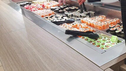 Self service station with rolls and sushi. Food