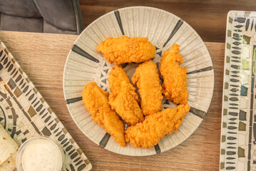 Fried chicken strips coated with chickpea flour, an equally delicious gluten-free alternative