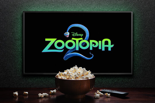 Zootopia 2 trailer or movie on TV screen. TV with remote control and popcorn bowl.