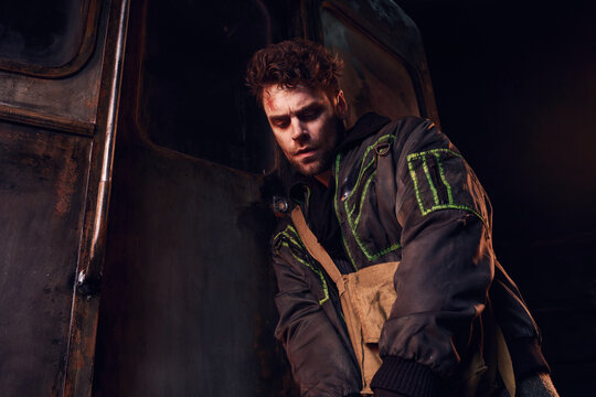 Exploring an abandoned environment, a young man reflects on survival and hope amid decay.