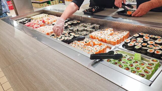 Self service station with rolls and sushi. Food